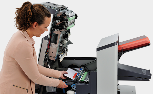 Person using Neopost DS-64i Folder Inserter